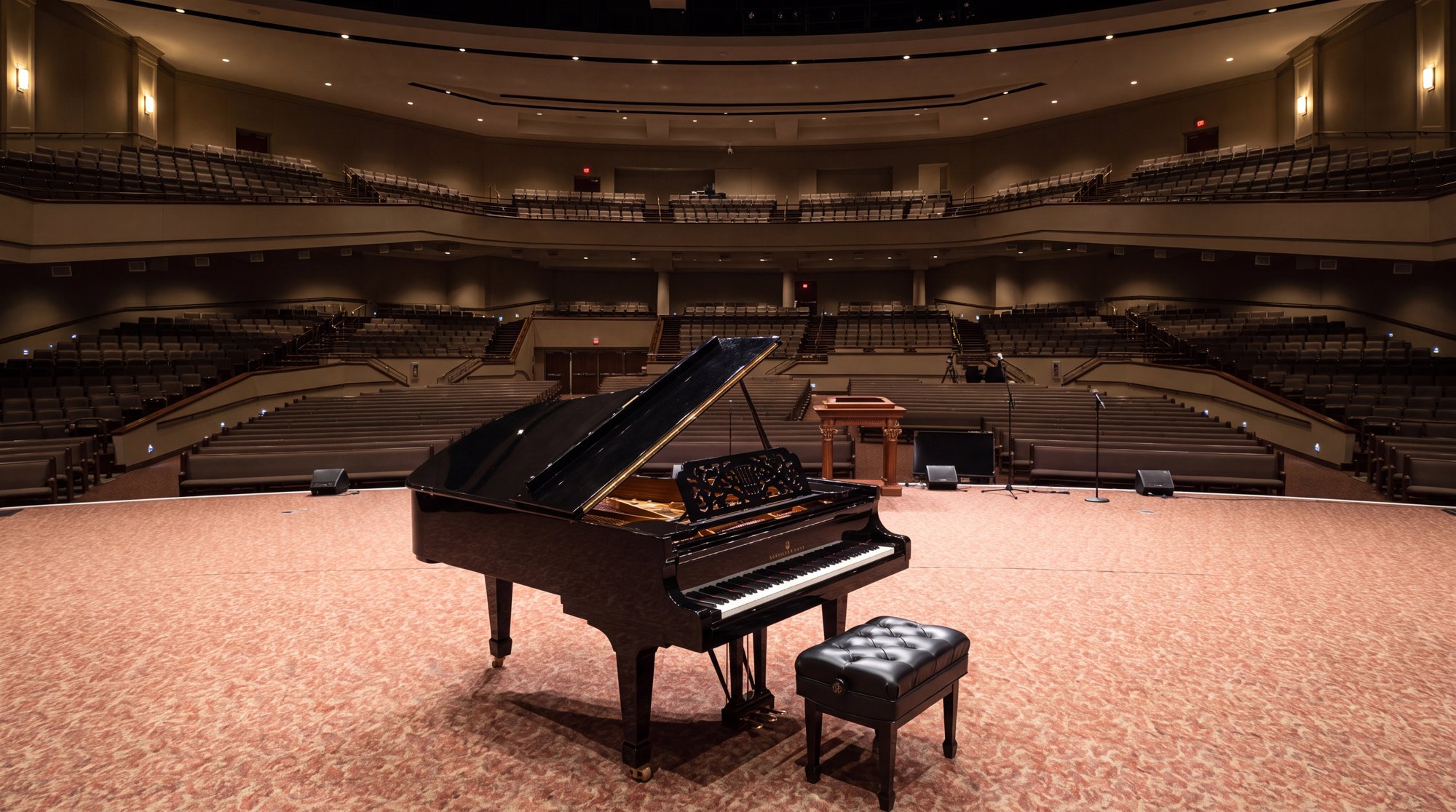 The Centre auditorium at Idlewild with a grand piano on stage